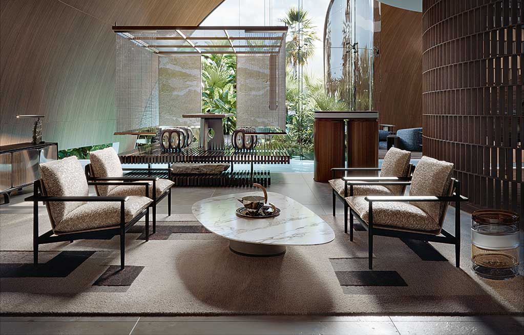 Modern living room with beige Giorgetti Kumiki armchairs, a marble coffee table, and a view of a lush garden through large windows, creating a serene ambiance.