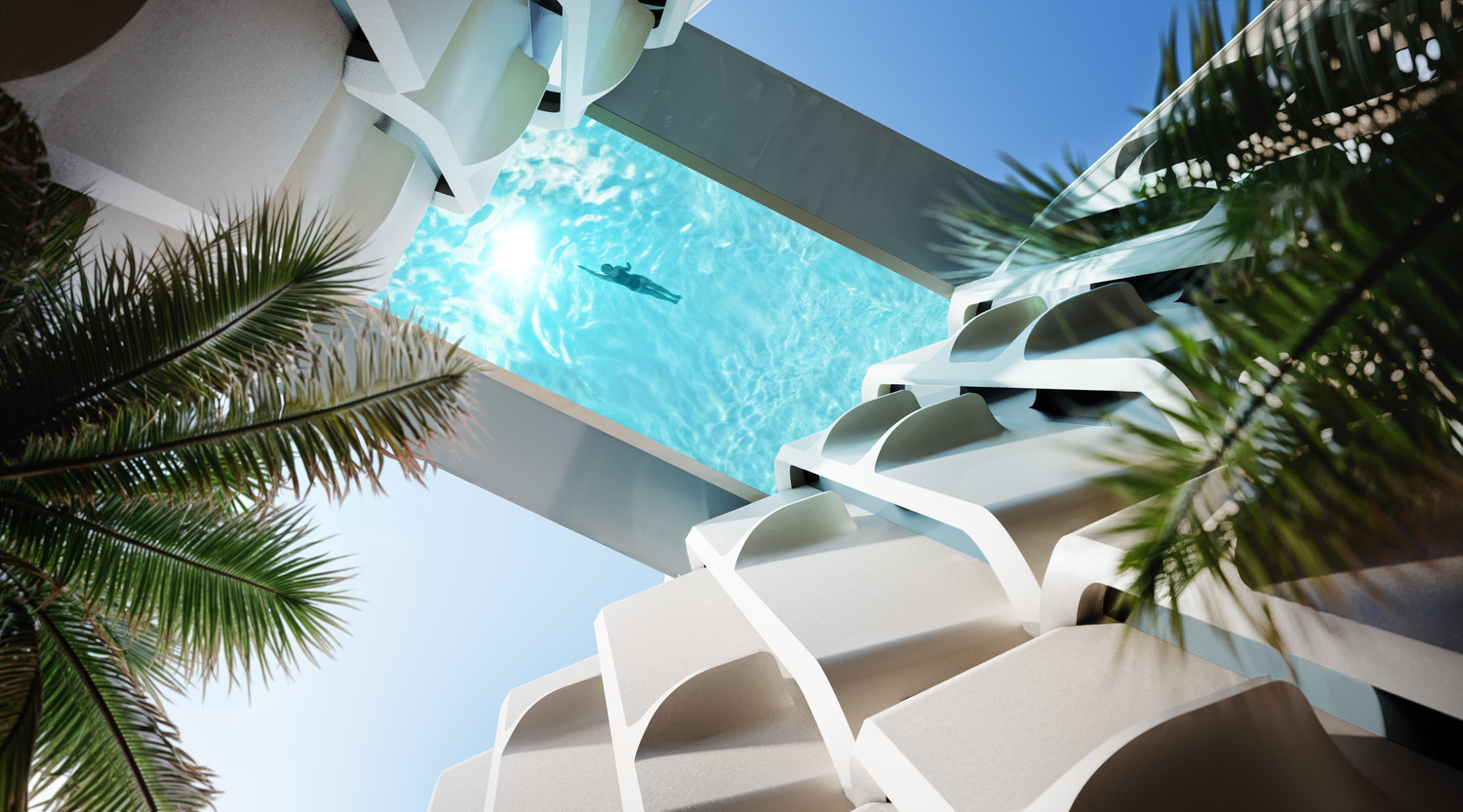 View from below of a futuristic building featuring a transparent rooftop pool with a swimmer. Framed by white structures and palm trees, under a clear blue sky.